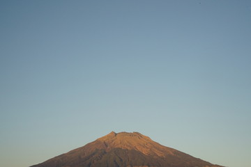 Great peak Sumbing mountain at Indonesia with yellow color because showering morning sun light