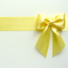 Golden bow and ribbon for holiday gift box, wedding greeting card banner, present wrap design decoration