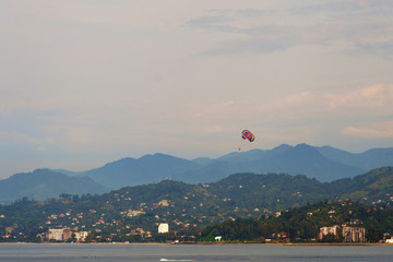 Parachutist is landing on the water