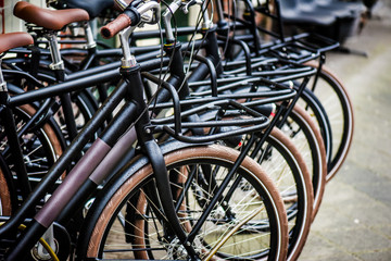 Bicycle parking in row. Denmark new modern city bikes for sell.