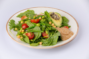 Healthy natural food. Salad with green vegetables, vitamins on the plate.
