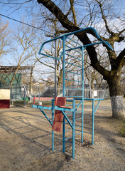 Sports town in the park. Horizontal bar, swedish wall and swing press.