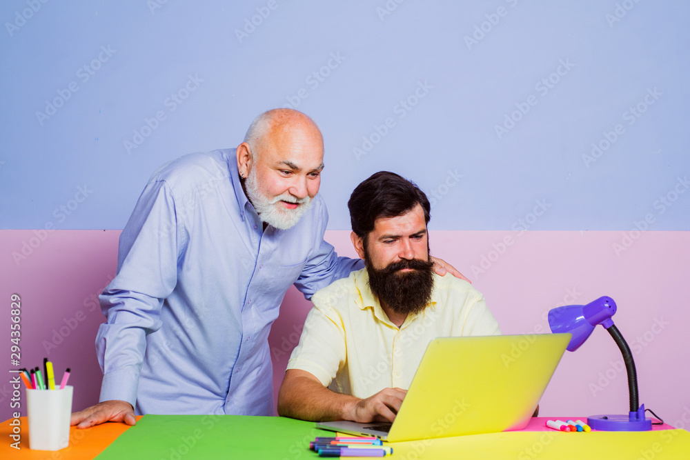 Wall mural business people having meeting around table in modern color office. two businessman sitting at the t