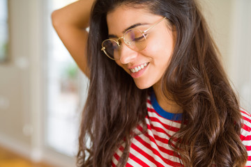 Young beautiful woman smiling cheerful wearing glasses looking happy with a big smile