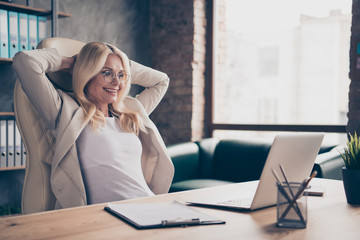 Photo of excited cheerful ecstatic woman working in front of her laptop with project finished and salary received according to annual income