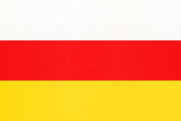 South Ossetia national fabric flag textile background. Symbol of world asian country.