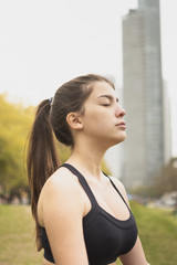 Fototapeta na wymiar Close-up fit young woman meditating