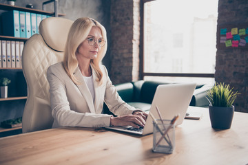 Photo of calm serene bussiness coach expecting her students join conversation in app to participate in training