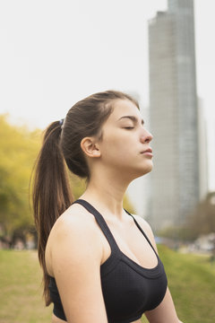 Close-up fit young woman meditating