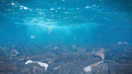 plastic pollution in ocean water, bags and bottles on the sea floor, micro plastic pollution