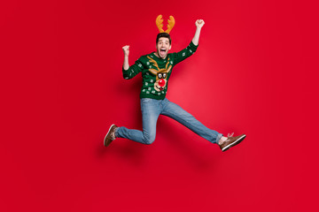 Full size photo of funny guy jumping high running to x-mas free shopping wildly shouting wear...