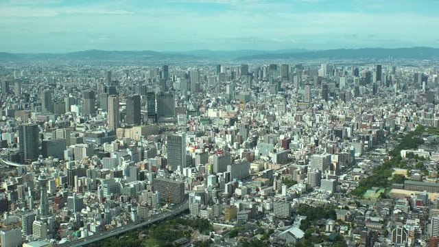 OSAKA, JAPAN - CIRCA SEPTEMBER 2019 : Aerial high angle view of CITYSCAPE of OSAKA in daytime. View of buildings around Namba, Shinsaibashi, Umeda and Osaka station.
