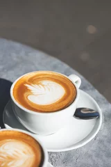 Foto op Plexiglas Flat white coffee on the table in the cafe © manuta