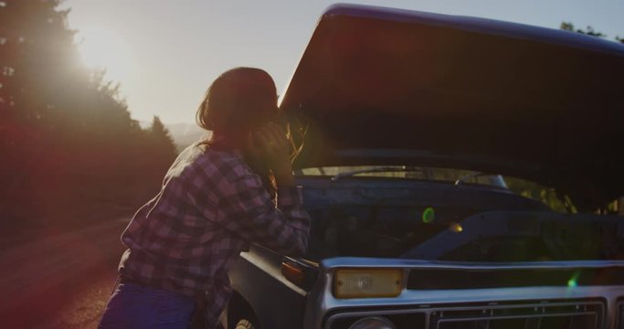 Young woman on a road trip in pick-up truck