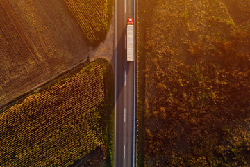 Truck on the road in sunset, top view © Bits and Splits