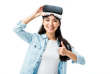 asian woman in denim shirt with virtual reality headset showing thumb up isolated on white