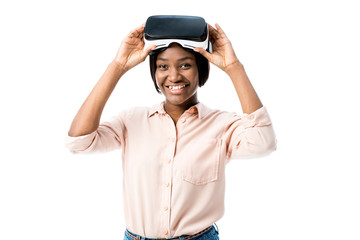 african american woman in shirt with virtual reality headset smiling isolated on white