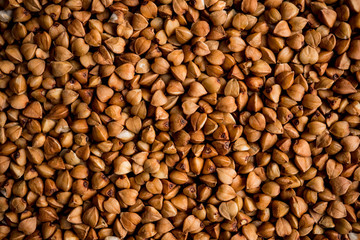 The texture of dry buckwheat. Background image of buckwheat porridge. Maro's Photo