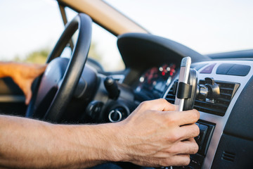 Man using phone while driving