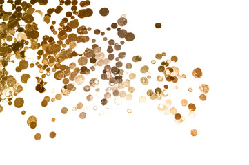 Gold glitter on white background, shiny confetti