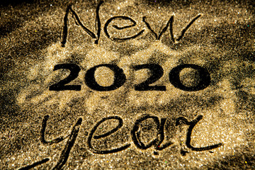 Happy New Year 2020. Beautiful sparkling Golden number 2020 on black background for design With Copy Space For Text. Beautiful Glowing overlay template for holiday greeting card