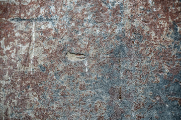 Texture of an old wall covered with paint. Background image of a worn paint coated surface