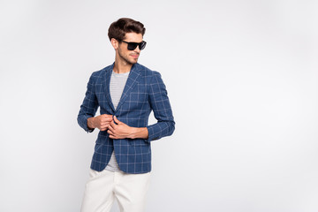 Portrait of his he nice-looking attractive content luxury rich wealthy businessman wearing checked blazer cool modern clothing fastening button isolated over light white pastel background