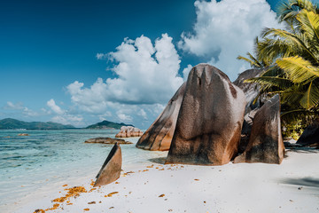 Famous Anse Source d'Argent beach on La Digue, Seychelles. Huge surreal shaped granite boulders on tropical shore