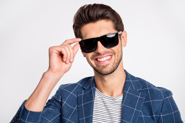 Close-up portrait of his he nice attractive lovely cheerful cheery glad businessman wearing blue checked blazer cool modern outfit touching specs isolated over light white pastel background