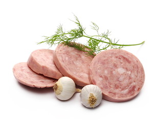 Traditional sausage salami slices with garlic cloves and fresh dill isolated on white background