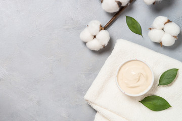 Clay mask and towel, skincare product.