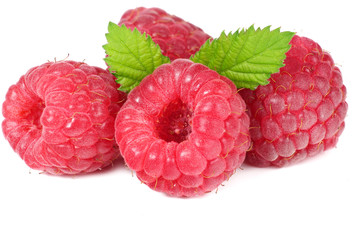 ripe raspberries with green leaf isolated on white background macro