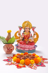 Indian Festival Diwali , Laxmi Pooja with Copper Kalash, coconut flower rangoli on white background