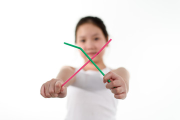 Young girl carry plastic straw