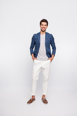 Full body photo of charming guy stand wear plaid clothes blazer jacket pants trousers isolated over...