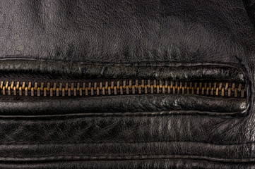 Old vintage genuine soft black leather texture background, top layer with pores and scratches,...