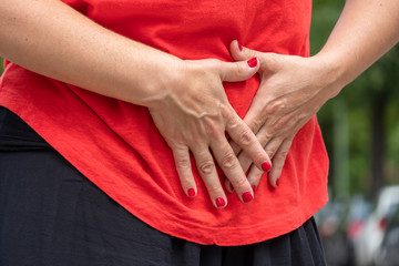 Pregnancy or stomach ache. Woman with menstrual or abdominal pain