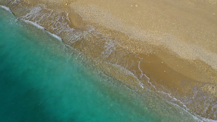 Aerial drone top down photo of tropical exotic sandy bay with emerald sea and waves