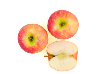 Sliced wet red apples isolated on white background ready to use in designs