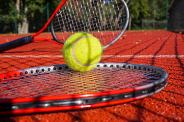 Tennis scene with net shadow, ball and racquet