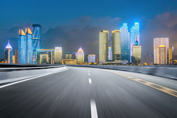 empty highway with cityscape and skyline of qingdao,China.