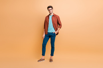 Fototapeta na wymiar Full length body size view of his he nice attractive fashionable content brunette guy partner cool expert company director owner isolated over beige color pastel background