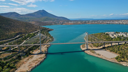 Aerial drone photo of marvel of Engineering suspension bridge connecting mainland with island over deep blue sea
