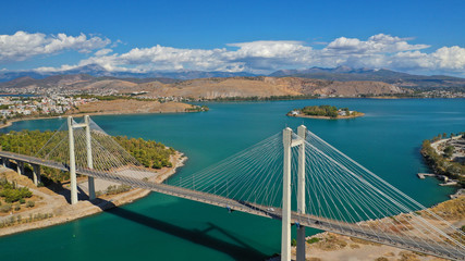 Aerial drone photo of marvel of Engineering suspension bridge connecting mainland with island over...