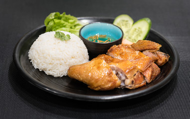 Roasted chicken with white rice and vegetables, served with fish sauce, vietnamese cuisine dish.