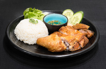 Roasted chicken with white rice and vegetables, served with fish sauce, vietnamese cuisine dish.