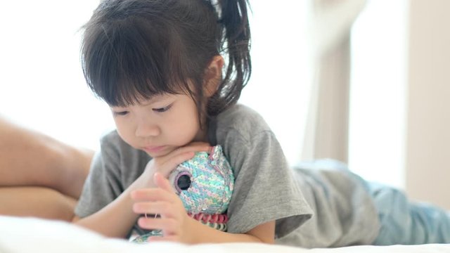 chinese child addicted phone, asian girl playing smartphone, kid use telephone, watching cartoon