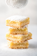 Lemon squares with powdered sugar.