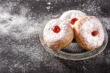 Hanukkah sufganiyot. Traditional Jewish donuts for Hanukkah.