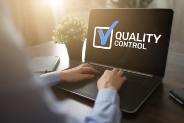 Quality control check box on device screen. Standards and certification, assurance, guarantee. Business concept.